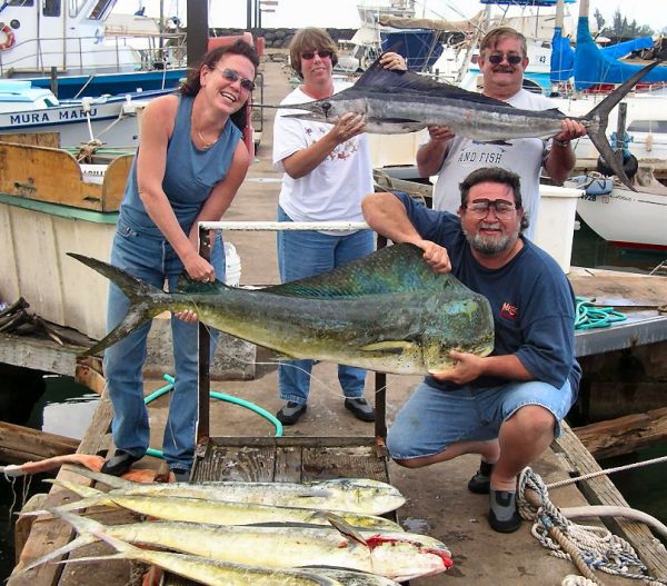 Foxy Lady 2-16-06
Deborah, Janet, Fred and Michael managed to scare up some nice Mahi Mahi. That big Bull is going to be on the wall in Fred's new sports bar. The Stripey was hooked right through the eye, so he got turned in to fish tacos. 
