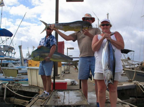 Foxy Lady 5-16-05
Eric, Dave and Roxanne with some nice ones. Our Marlin bite today makes us 0/6 on Marlin our last few trips. Ouch. 
But that 29 pound Aku (Skipjack Tuna) is the biggest for the year. Nice job Roxanne! 
