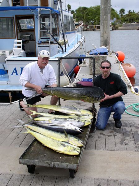 Foxy Lady 5-7-07
Kevin and Jason and their fish. 6 Mahi Mahi and 2 Yellowfin Tuna. Not too shabby for a 1/2 day.
