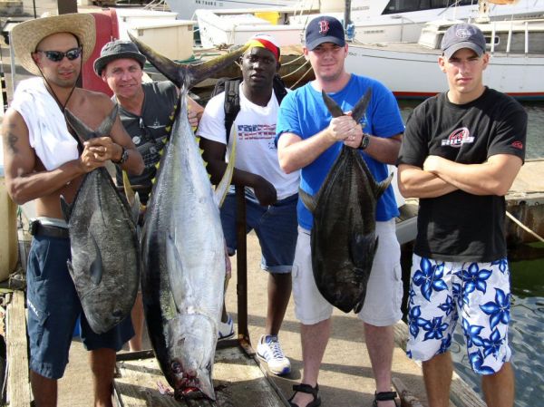6-5-04
Ashley and Marc rounded up a few of their freinds and went out for another trip. A 150 pound Ahi was a nice reward. Not to mention the 2 White Ulua's. WOW.
Enjoy the fish gang!
