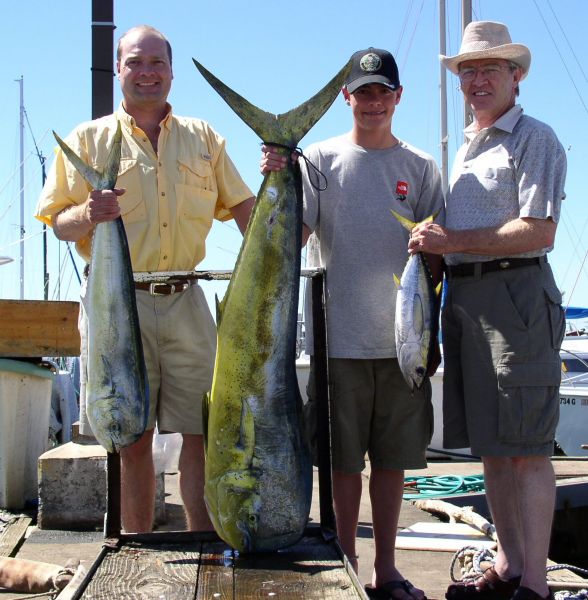 Foxy Lady 6-9-06
Brad, Tanner and Bert. Three generations of fishermen spent the day on the water and managed to round up a few fish. Tanner's bull Mahi Mahi weighed a respectable 47 pounds, very nice.
