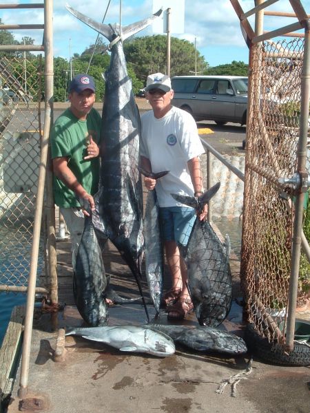 Foxy Lady 7-22-05
The Green men and their afternoon delight. A nice 130 pound Blue Marlin, a 20 pound Ono for the grill and a 4 banger Ulua (Giant Trevally) just because they are lucky guys!

